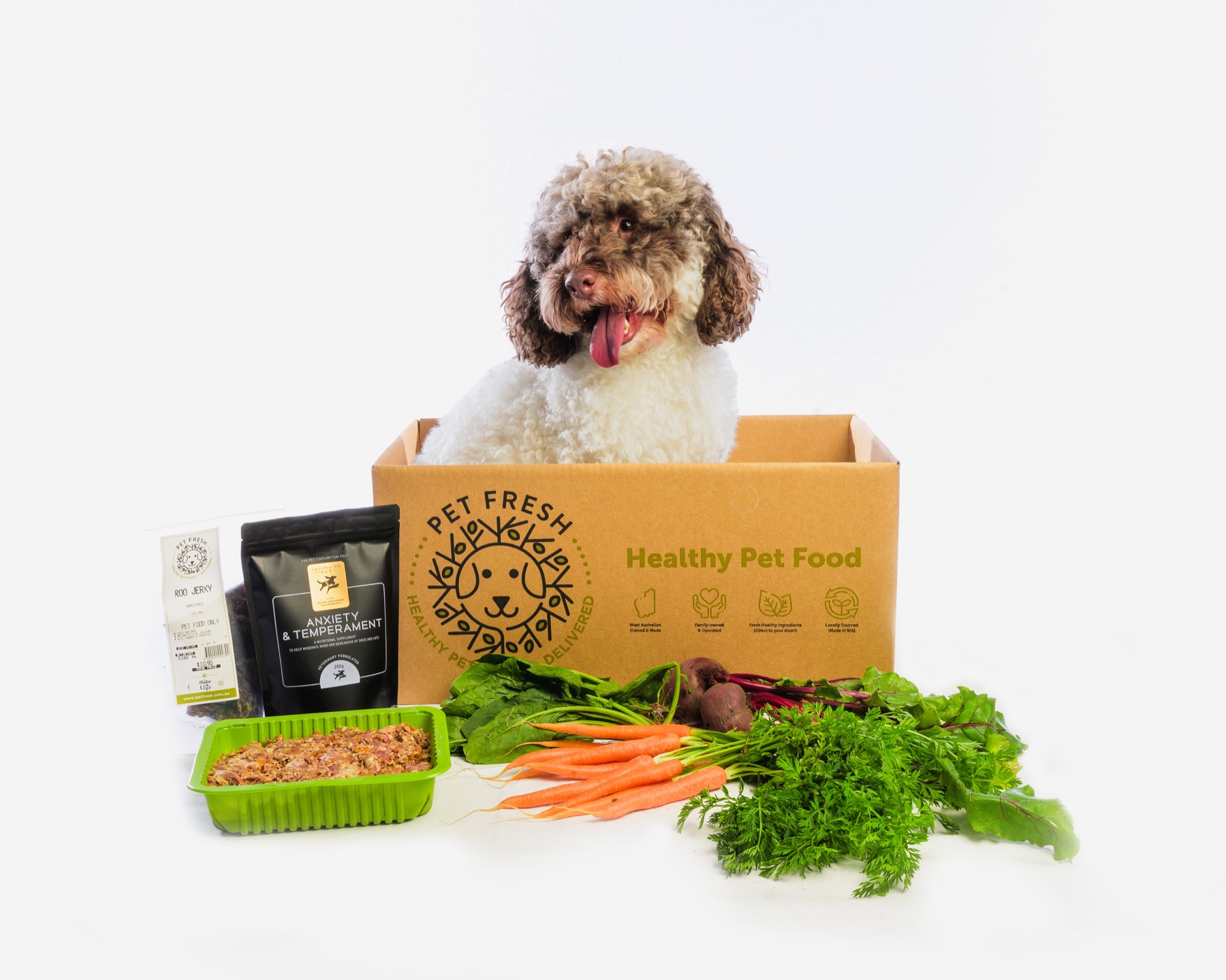 Dog in a Pet Fresh box with vegetables